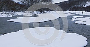 River passing through a mountain gorge in winter