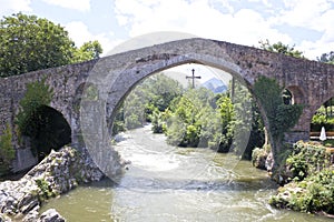 River passing by Roman bridge in Cangas de OnÃ­s