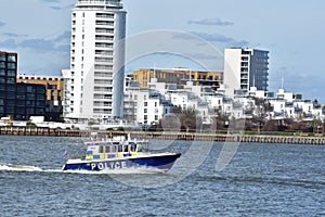 River police boat patrolling on the Thames river