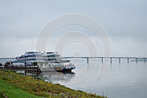 River port berth cruise ships boat dock, away bridge, fog low