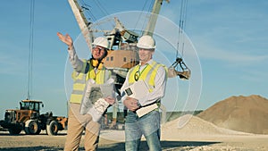 River port with male engineers talking about construction project