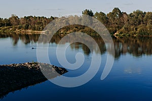 The river with a quiet current and clouds reflected in it, Soz , Gomel, Belarus