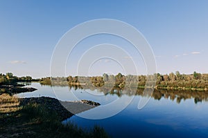 The river with a quiet current and clouds reflected in it, Soz , Gomel, Belarus
