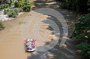 River rafting in Greece above view. People in safety gear on a raft, Vale of Tempi, Thessaly