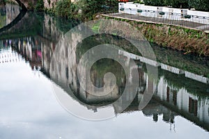 River with a reflection of a building in the water