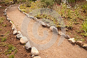 River Rock Lined Dirt Garden Path