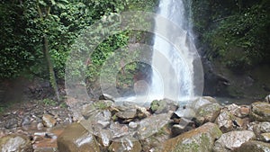 River rock with waterfall background
