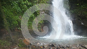 River rock with waterfall background