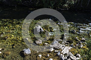 River with rocks as background of Lleida, Catalonia, Spain photo