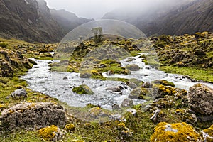River, rocks and clouds in Collanes Valley in El Altar volcano