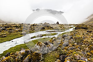 River, rocks and clouds in Collanes Valley in El Altar volcano