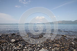 River Rocks, colors stone on Idyllic crystal seawater in front of luxury hotel, attractive clear sea, nature coastline backgrounds