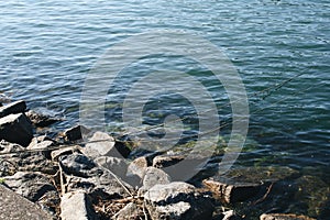 River rocks with fisherman cords