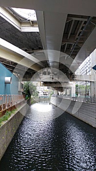 River running beneath highway in Tokyo