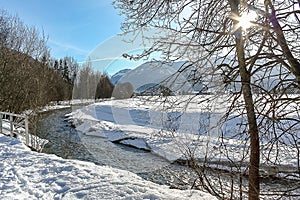 River running through a snow landscape near Flachau Austria