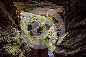 River running through stone cave in Carrancas rainforest