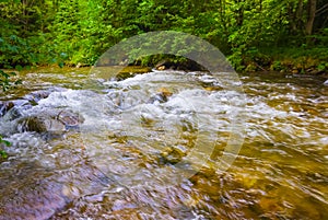 river rushing through the mountain canyon