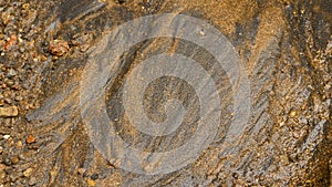 River sand texture with a mixture of iron ore and pebbles