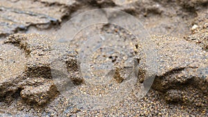 River sand texture with a mixture of iron ore and pebbles