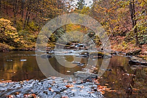 River scene in the forest surrounded with fall foliage