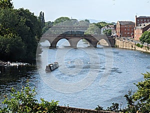 The River Severn at viewed from Worcester Cathedral,with canal boat and swans,Worcestershire,England,UK