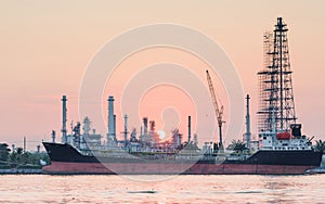 River side oil refinery industry plant along sunrise