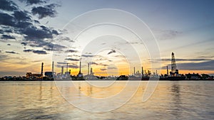 River side oil refinery industry plant along twilight morning