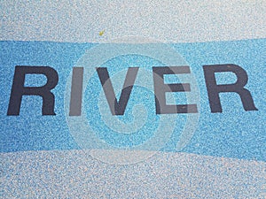 River sign on rubberized blue ground or floor