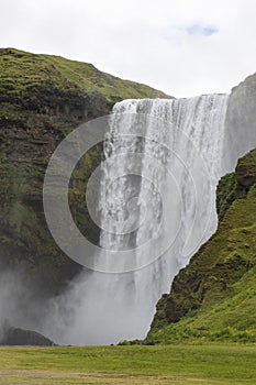 The river Skoga plunging over the Skogafoss waterfall in souther