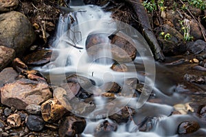 River with small waterfall and many rocks