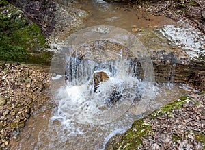 river - sources in mountainous terrain, cloudy day, spring walks in the bosom of nature, panorama of the area.