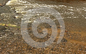 River water texture background with bubbles.