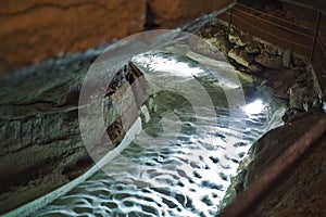 a river in a stalactite cave is going trough