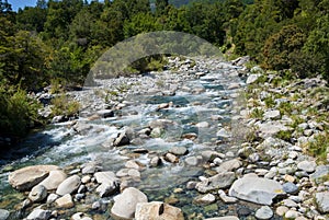 River with a stony bed in the mountain photo