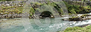 River Storfossen runs down the mountain to the Geiranger Fjord, Norway. Nature landscape, river.