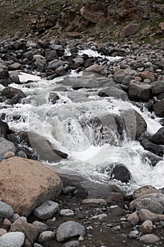 River stream waterfall in mountain landscape