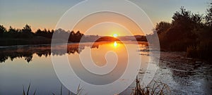 River sunrise in the summer season