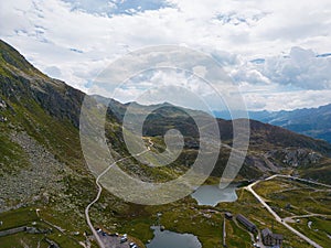 River surrounded by Gotthardpass in Schweiz with blue sky in the background