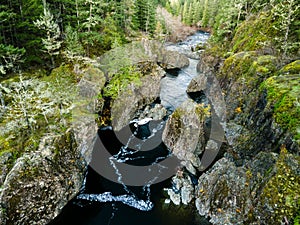 River surrounded by rocks and trees in Sooke Potholes Provincial Park, Vancouver Island