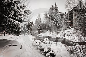 A river surrounded by snow in Vail, Colorado during winter.