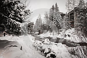A river surrounded by snow in Vail, Colorado during winter. photo