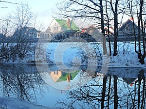 River Sysa and homes in winter, Lithuania