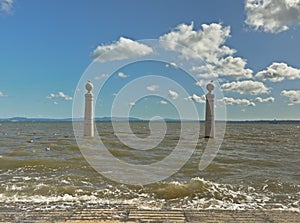 River Tagus with pillars of Cais da colunas quay in front, Lisbon