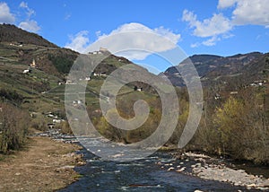 River Talfer and distant view of St Jakob In Sand, chapel near Bolzano