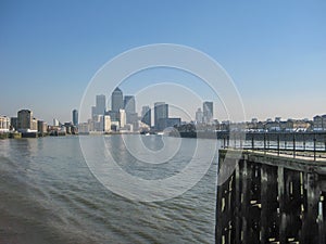 River Thames with Canary Wharf skyscrapers, in London, UK