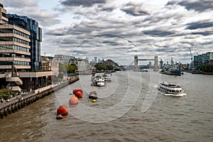 River Thames With Tower Bridge And Warship Belfast In Front Of London Skyline With Modern Skyscrapers In The UK