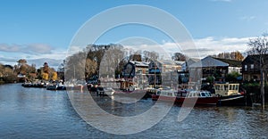 The River Thames at Twickenham, London UK, with Eel Pie Island on the right of the photo, photographed on a bright winter`s day.