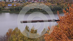 River tug with a barge. River channel for freight transportation, top view.