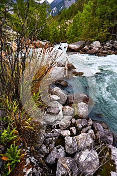 The river of turquoise color in mountains