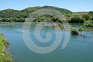 River Una on a summer day in Hrvatska Kostajnica, Croatia photo